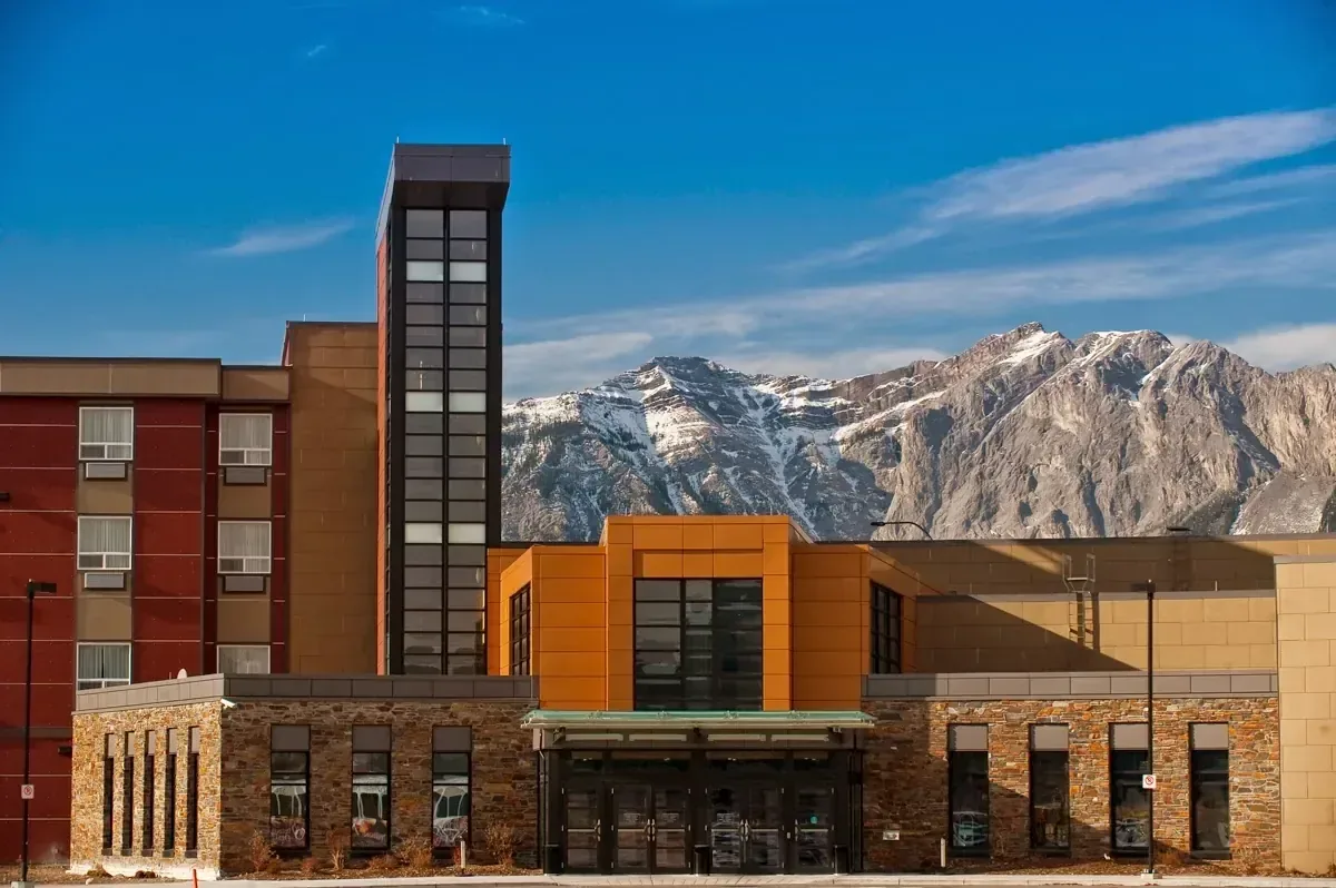 Mountain resort exterior against ridgelines